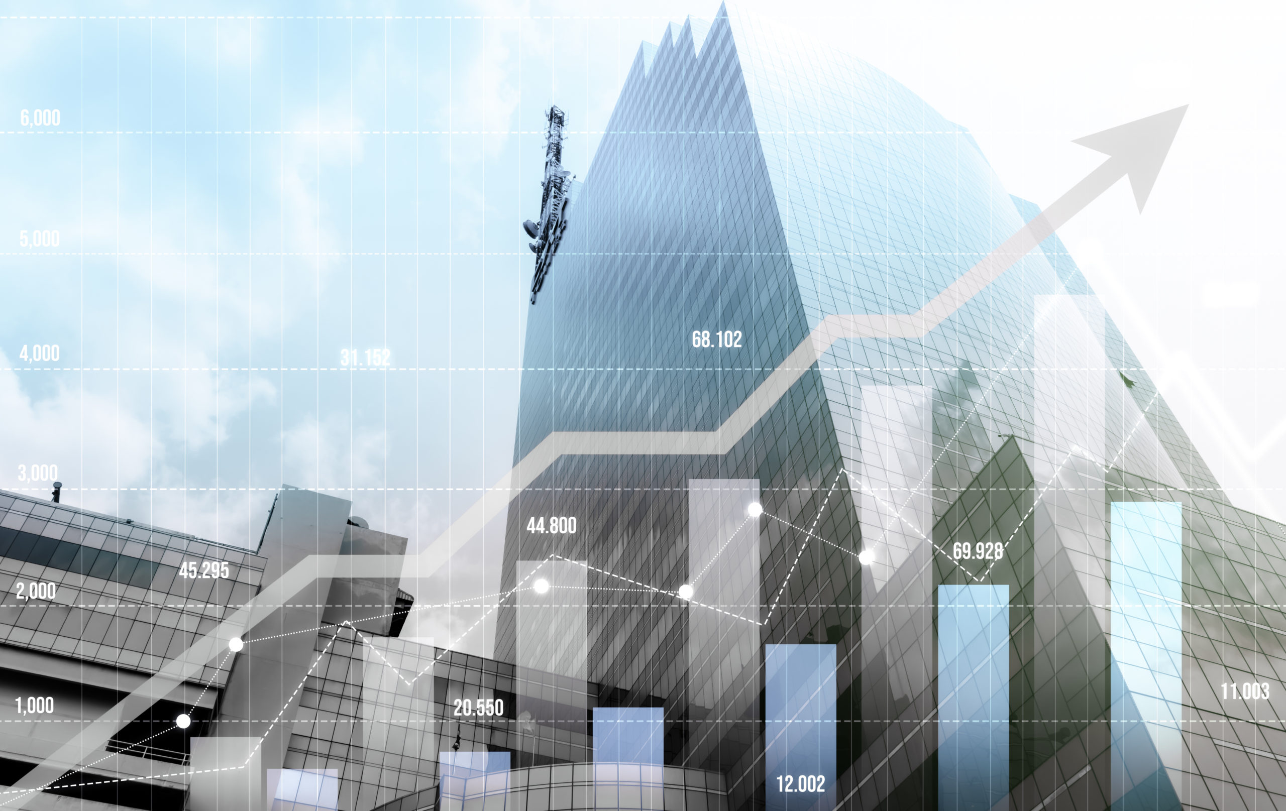 Image of financial graphs overlapping a tall business building. interest rates