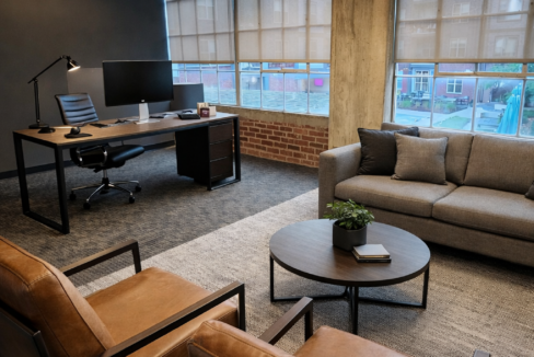 Modern industrial office with cozy seating